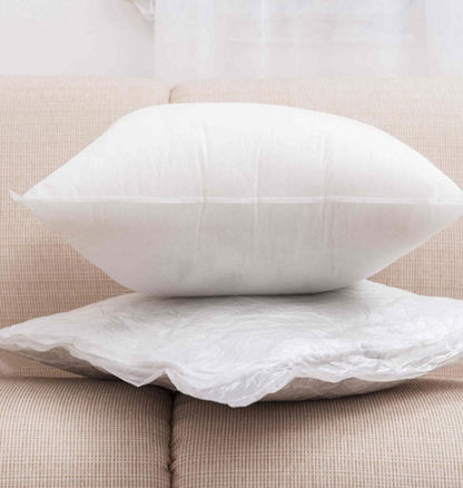 White pillow on a beige sofa