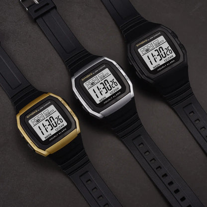 Three digital watches with black straps on a dark gray background