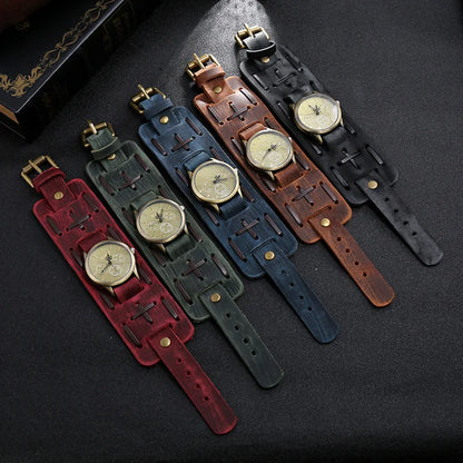 Set of four wristwatches with different colored leather straps on a dark surface