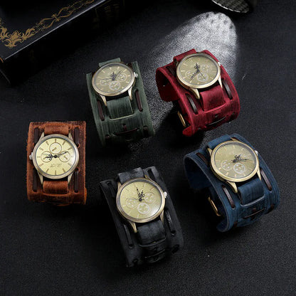 Five wristwatches with different colored leather straps on a dark surface