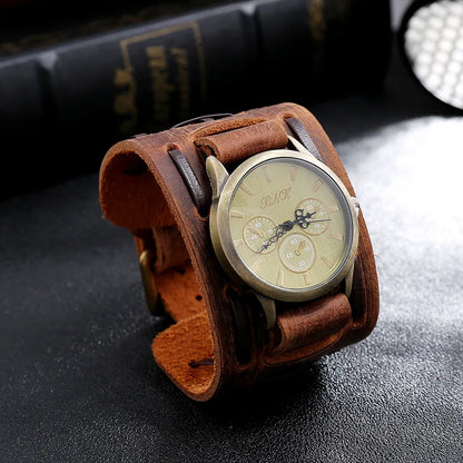 Brown leather wristwatch with detailed face on a dark surface