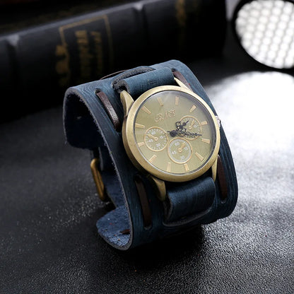 Wristwatch with blue leather strap on a dark surface