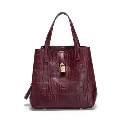 Maroon handbag with 'CHIC' text pattern on a white background