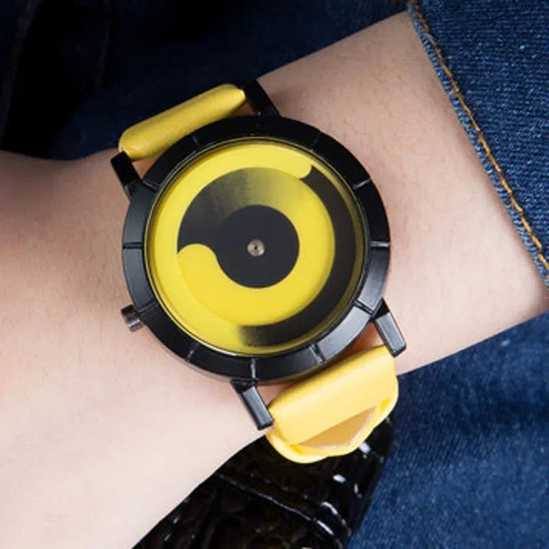 Wrist wearing a unique watch with a yellow and black design on a person's wrist.