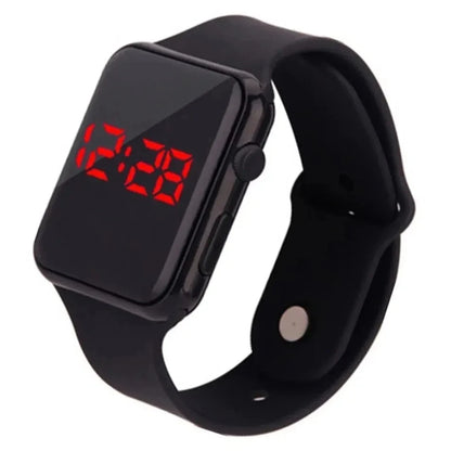 Black digital watch with red LED display on a white background