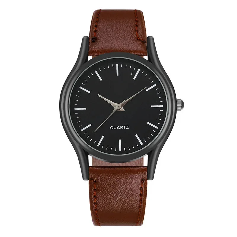 Wristwatch with black dial and brown leather strap on a white background