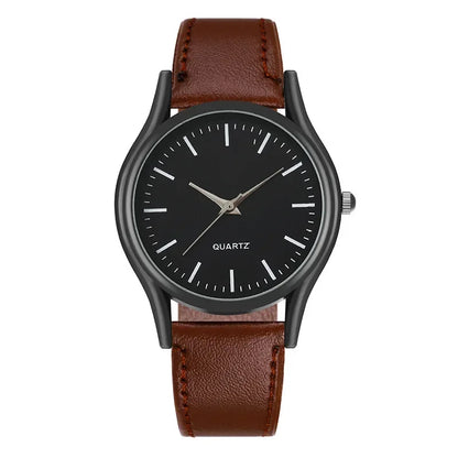 Wristwatch with black dial and brown leather strap on a white background