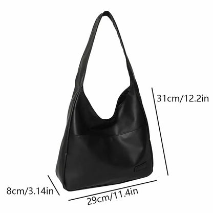 Black handbag with measurements on a white background