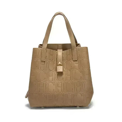 Beige handbag with embossed logo pattern on a white background