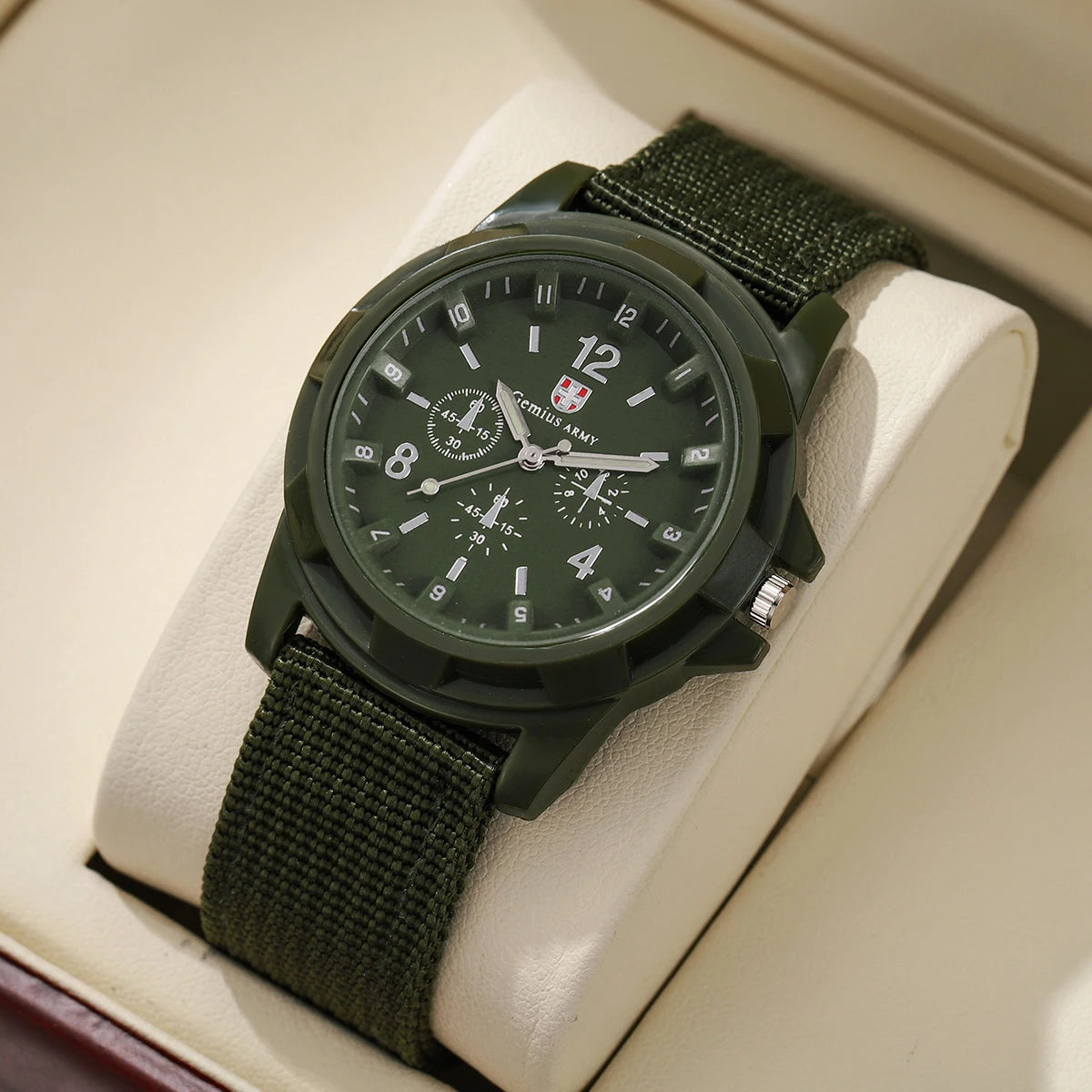 Green watch with detailed face on a beige cushion