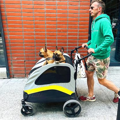 Man pushing a pet stroller with a dog inside, against a brick wall.