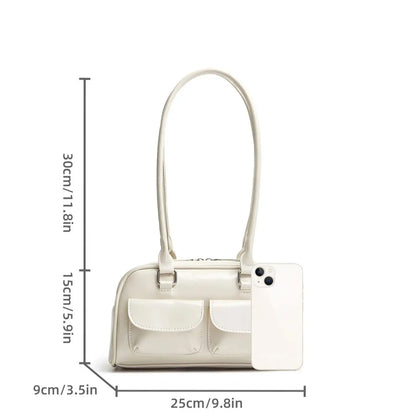 White handbag with dimensions indicated on a white background