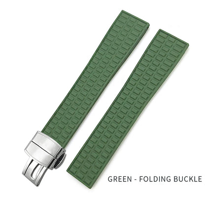 Green watch strap with silver folding buckle on a white background