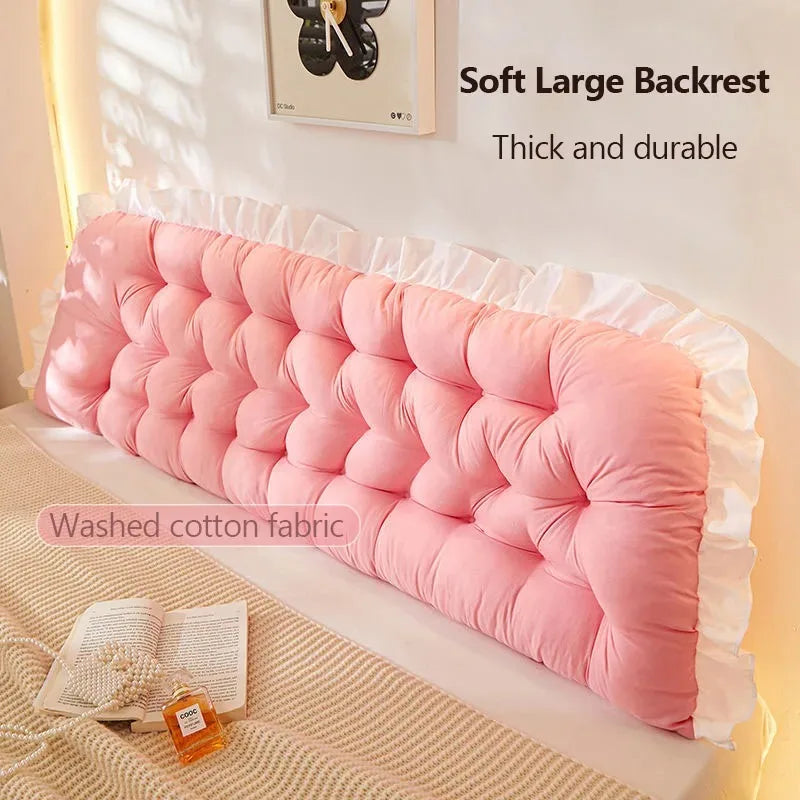Pink soft large backrest on a bed with text indicating it is thick, durable, and made of washed cotton fabric.