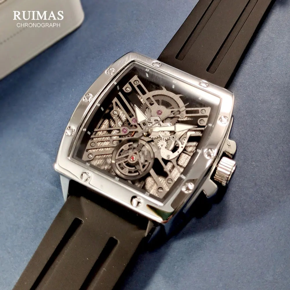 Luxury watch with black strap and visible mechanical components on a blue background, featuring the brand 'RUIMAS'.
