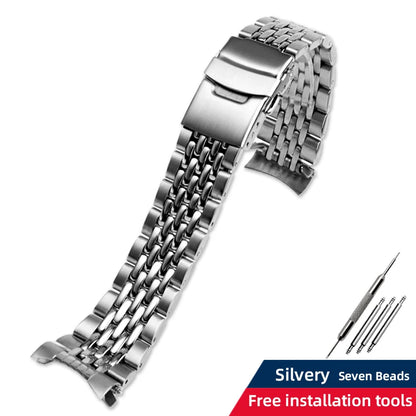 Silver watch strap with installation tools on a white background