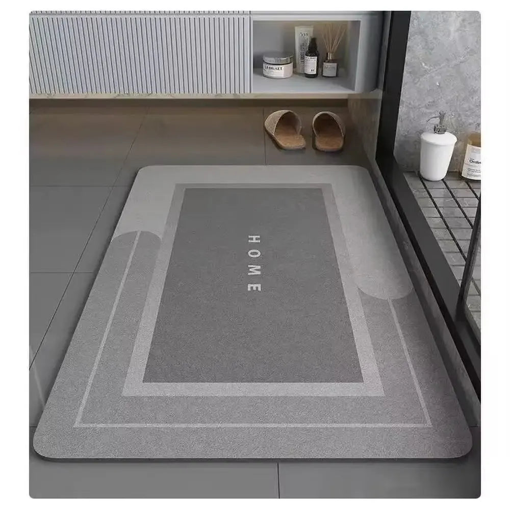 Gray doormat with 'HOME' text on a tiled floor