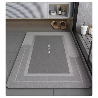 Gray doormat with 'HOME' text on a tiled floor