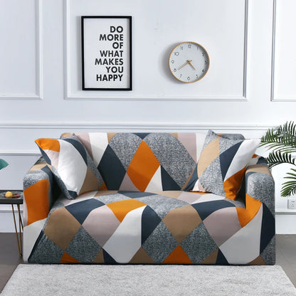 Geometric patterned sofa in a living room with motivational poster and clock on the wall.