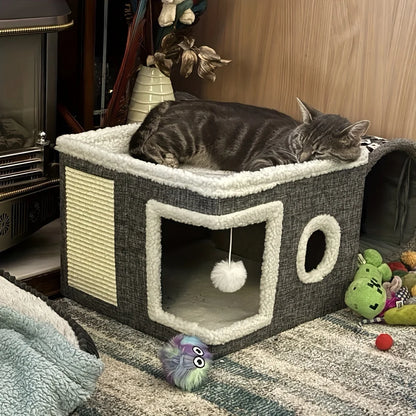 Cat sleeping on a cat tree with toys around in a cozy room.