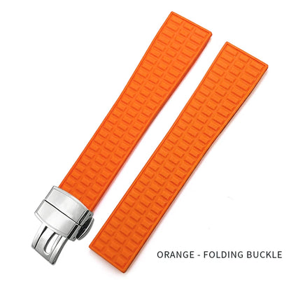 Orange watch strap with silver folding buckle on a white background