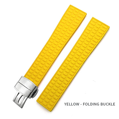 Yellow watch strap with silver folding buckle on a white background