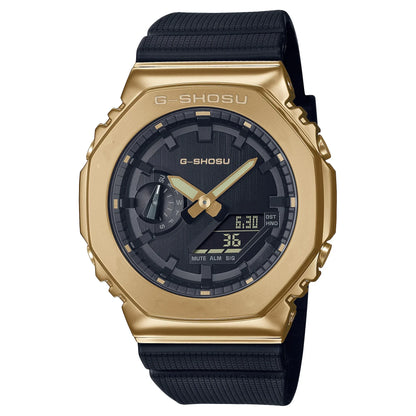 Gold G-Shock watch with black strap on a white background