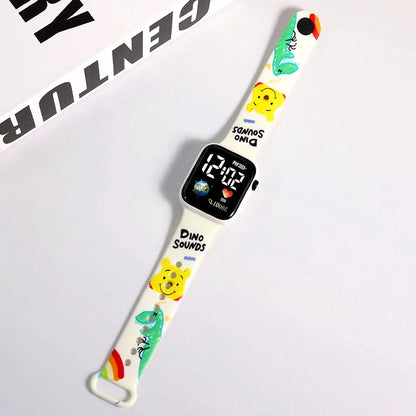 Digital watch with a colorful dinosaur-themed band on a white background