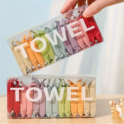 Colorful folded towels in a transparent box with 'TOWEL' text.