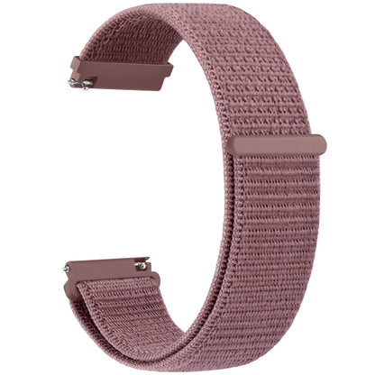 Pink woven watch strap on a white background