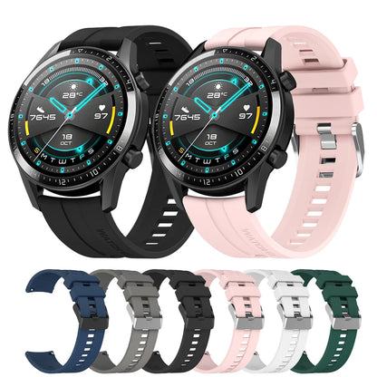 Two smartwatches with different colored straps on a white background