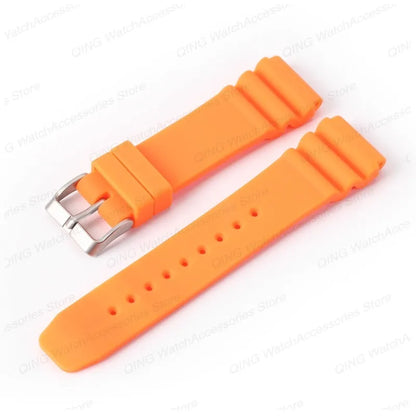Orange watch strap with silver buckle on a white background