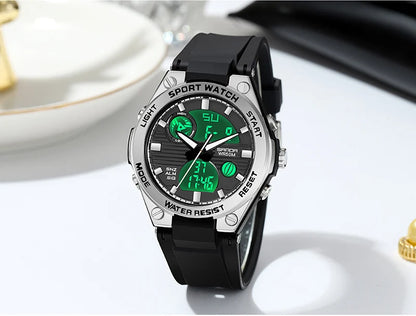 Sport watch with black strap and green digital display on a white surface