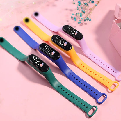 Colorful digital wristbands on a pink background