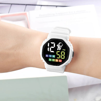 Digital watch on a wrist with a white strap