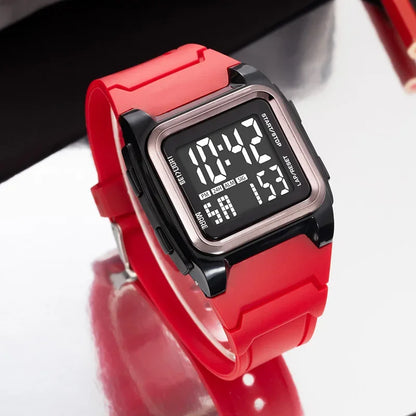 Red digital watch with a black face on a white background