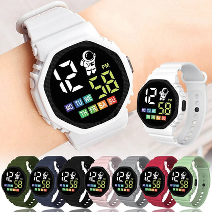 Digital watch with colorful display on a wrist, surrounded by various colored straps.