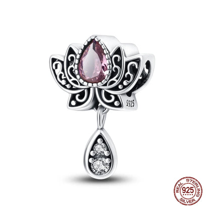 Silver pendant with pink gemstone and '925' stamp on a white background