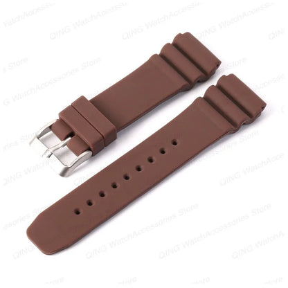 Brown watch strap with silver clasp on a white background