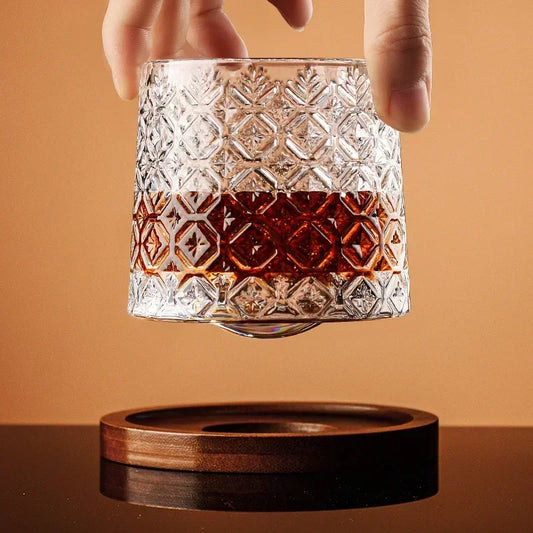 Glass with a wooden coaster on a brown background