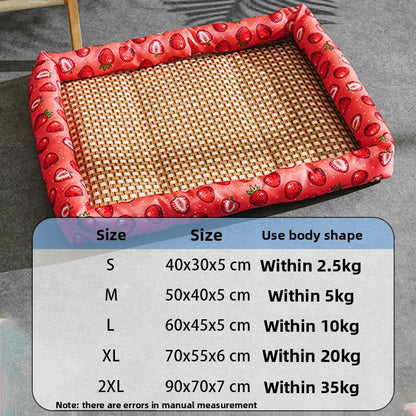 Pet bed with strawberry pattern and size chart on a gray surface
