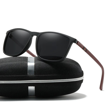 Black sunglasses with brown accents on a black case against a white background