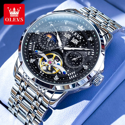 Silver OLEVS watch with detailed face on a blue background
