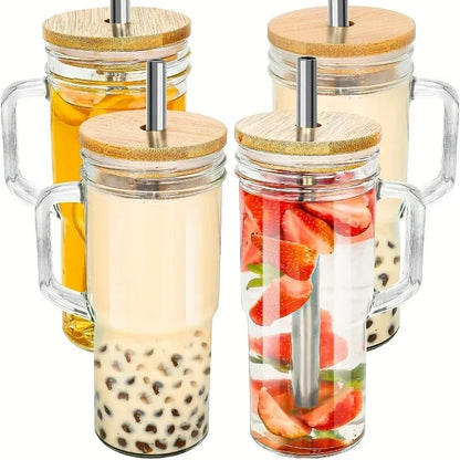 Set of four glass jars with wooden lids and straws, filled with different contents.