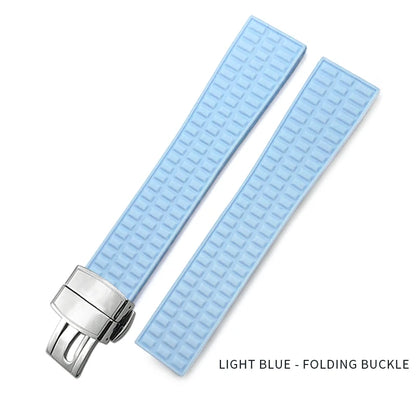 Light blue watch strap with silver folding buckle on a white background