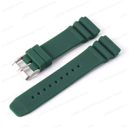 Green watch strap with silver buckle on a white background