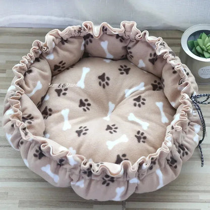 Pet bed with paw and bone pattern on a wooden surface