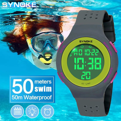 SYNOKE digital watch with green display on a blue underwater background